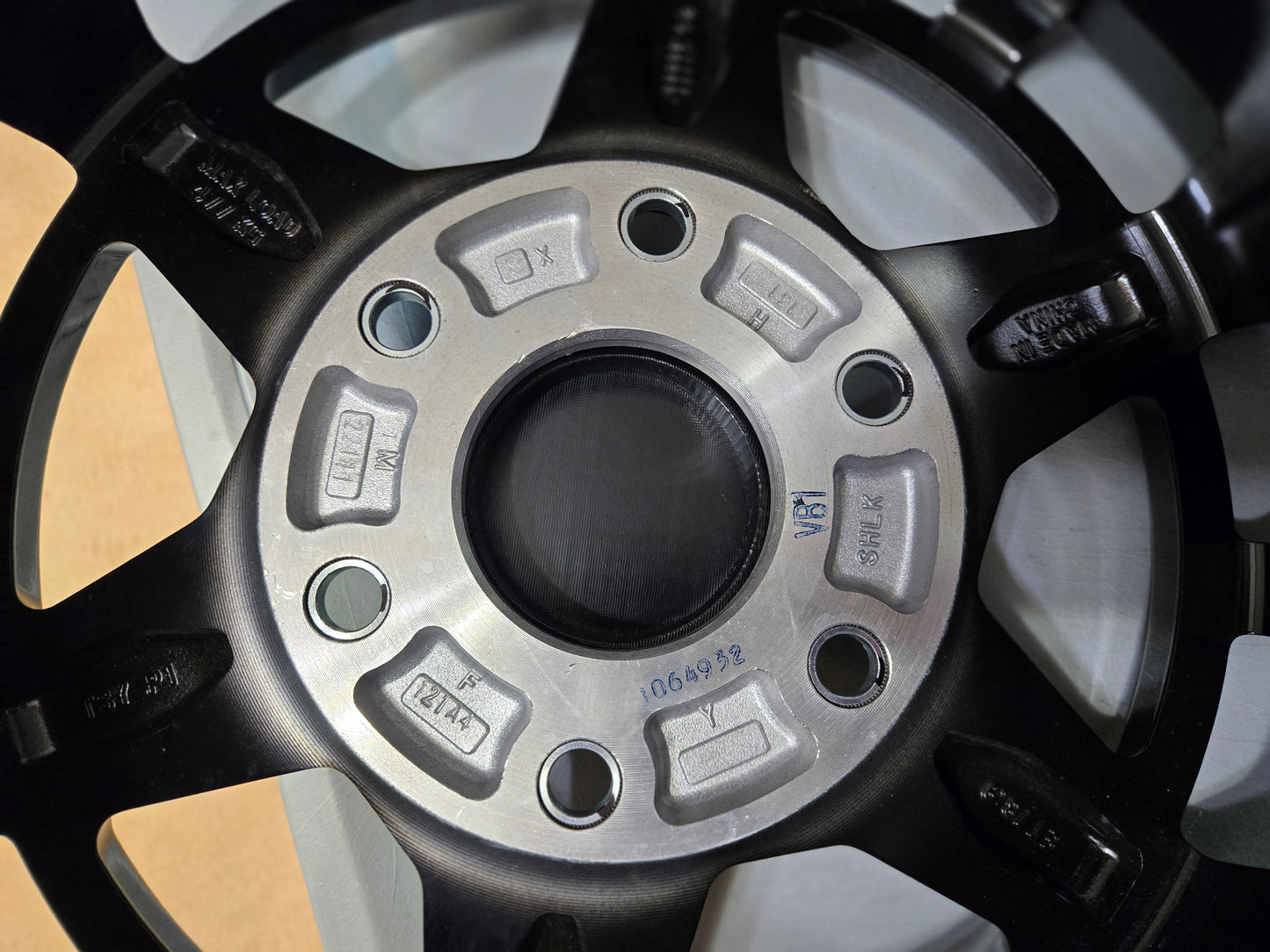 Can Am Maverick R OEM wheel black center caps with BRP logo