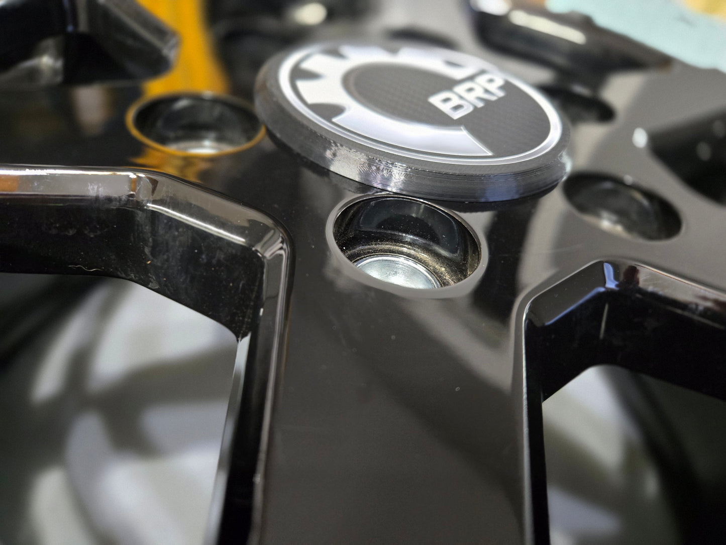 Can Am Maverick R OEM wheel black center caps with BRP logo